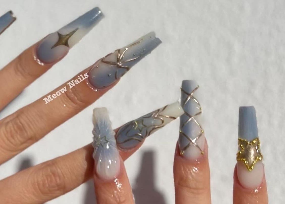 Elegant nail art with stars and gold accents at Meow Nails Mawson Lakes, Mawson Lakes, South Australia, AU.