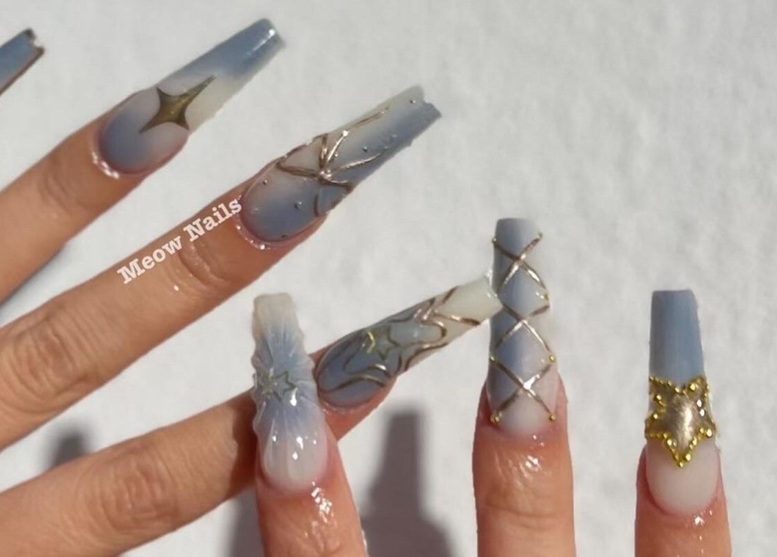 Elegant nail art with stars and gold accents at Meow Nails Mawson Lakes, Mawson Lakes, South Australia, AU.