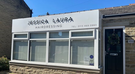 Jessica Laura Hairdressing storefront in Calverley, England, GB on a sunny day.