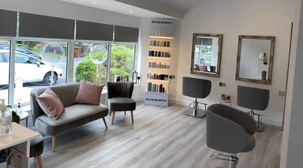 Modern interior of Jessica Laura Hairdressing in Calverley, England, GB with stylish seating and serene decor.