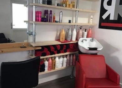 Cozy salon wash station at Julie at Reflections Hair Studio, Herstmonceux, England, showcasing beauty products.