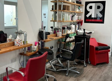 Modern hair studio at Julie at Reflections Hair Studio, Herstmonceux, England, GB with styling stations and products.