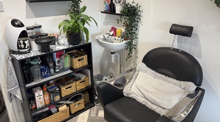 Comfortable salon chair and organized shelf at The BeautyVix at Salon V, Leigh, England, GB.