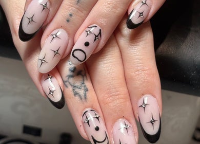 Chic star-patterned nails at The BeautyVix at Salon V, Leigh, England, GB, showcasing unique nail art.