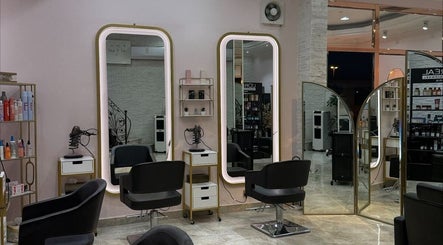 Modern beauty stations at Leen Beauty Center, Sharjah, Sharjah, AE, featuring stylish mirrors and salon chairs.