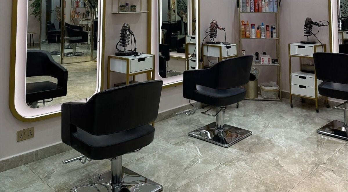 Elegant interior of Leen Beauty Center in Sharjah, Sharjah, AE showcasing stylish salon chairs and mirrors.