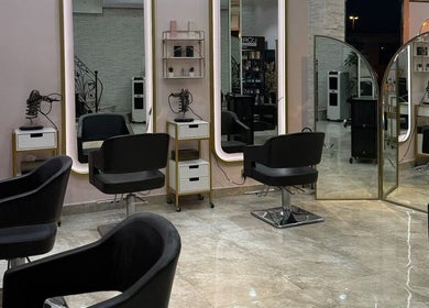 Stylish salon chairs and mirrors at Leen Beauty Center, Sharjah, Sharjah, AE, reflecting modern elegance.