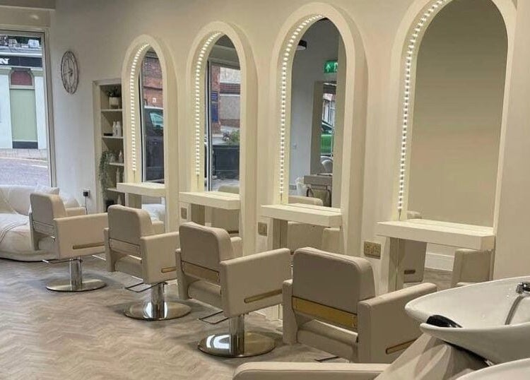 Sleek salon interior at Debut - Stanford-Le Hope, featuring mirrors and chairs. Located in Stanford le hope, England, GB.