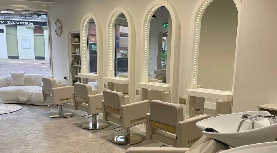 Sleek salon interior at Debut - Stanford-Le Hope, featuring mirrors and chairs. Located in Stanford le hope, England, GB.