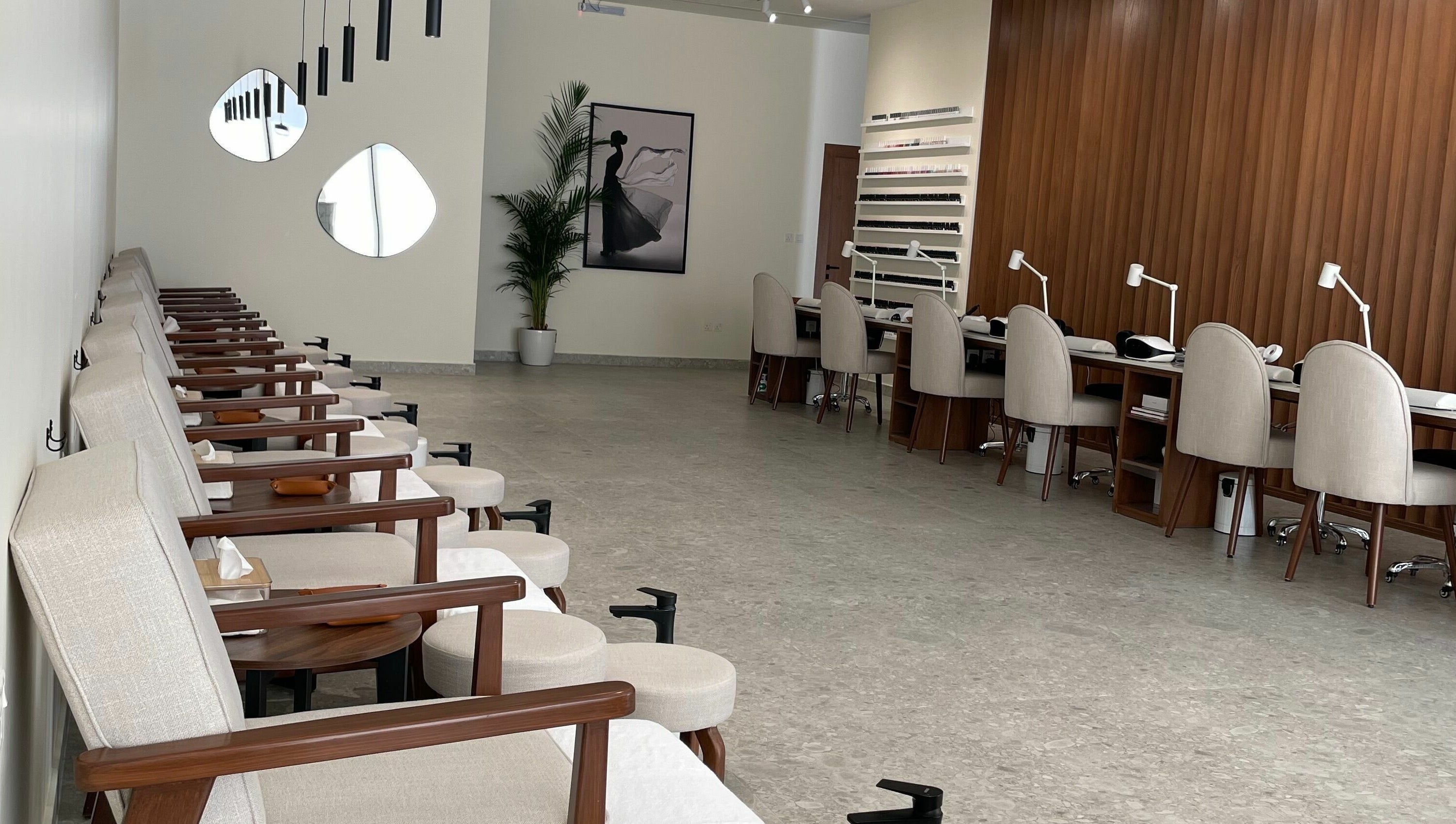 Naya Spa interior with chic manicure stations in Riyadh, Riyadh Province, SA, offering luxury wellness services.