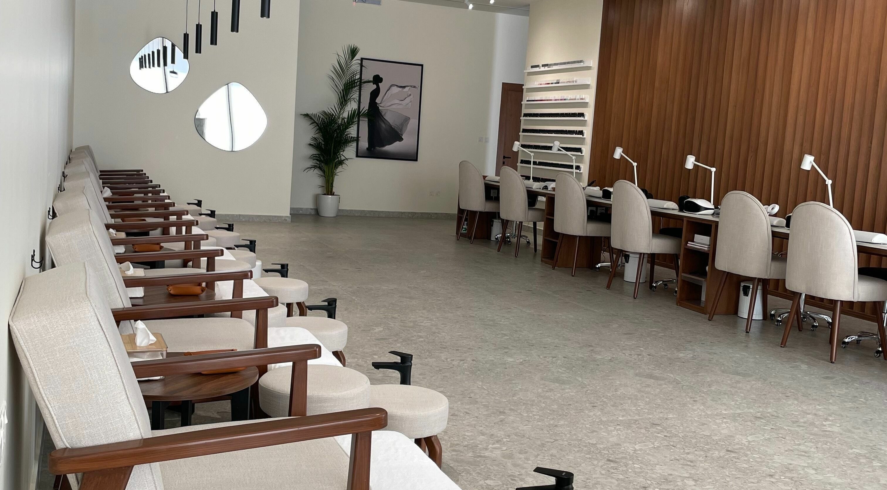 Naya Spa interior with chic manicure stations in Riyadh, Riyadh Province, SA, offering luxury wellness services.