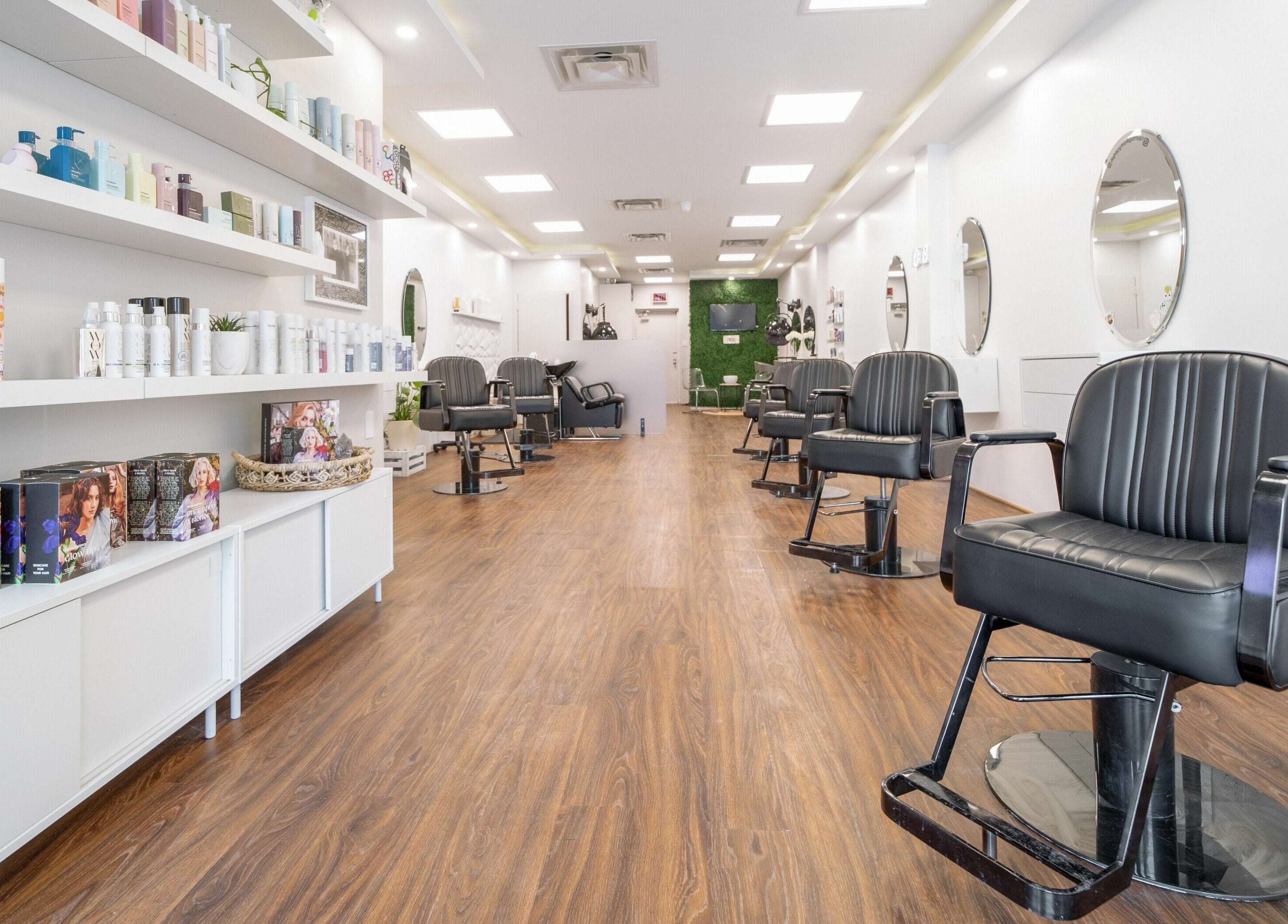 Modern interior of Twin Scissors salon in Toronto, Ontario, CA featuring sleek chairs and stylish decor.