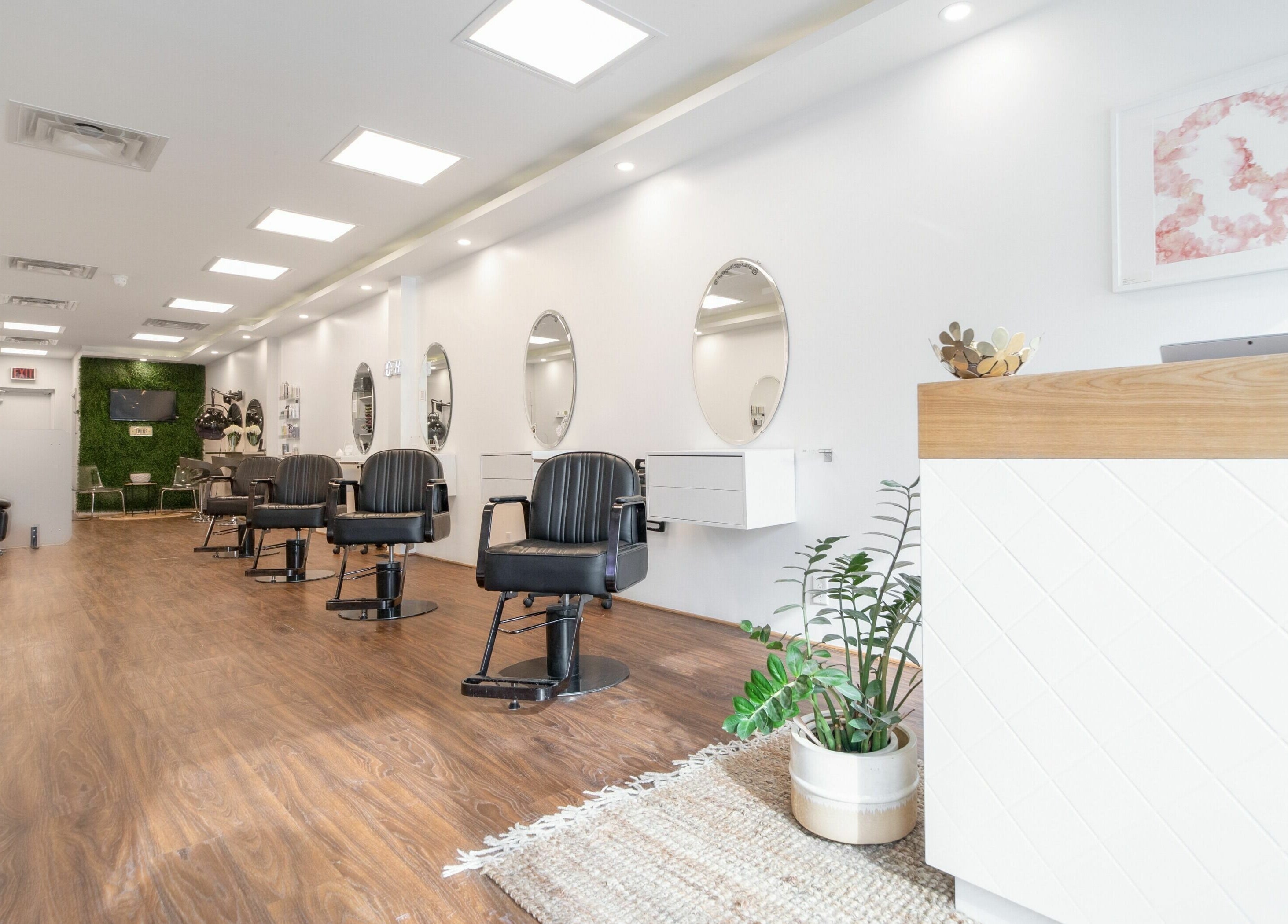 Chic interior of Twin Scissors salon in Toronto, Ontario, CA with modern chairs and decor.