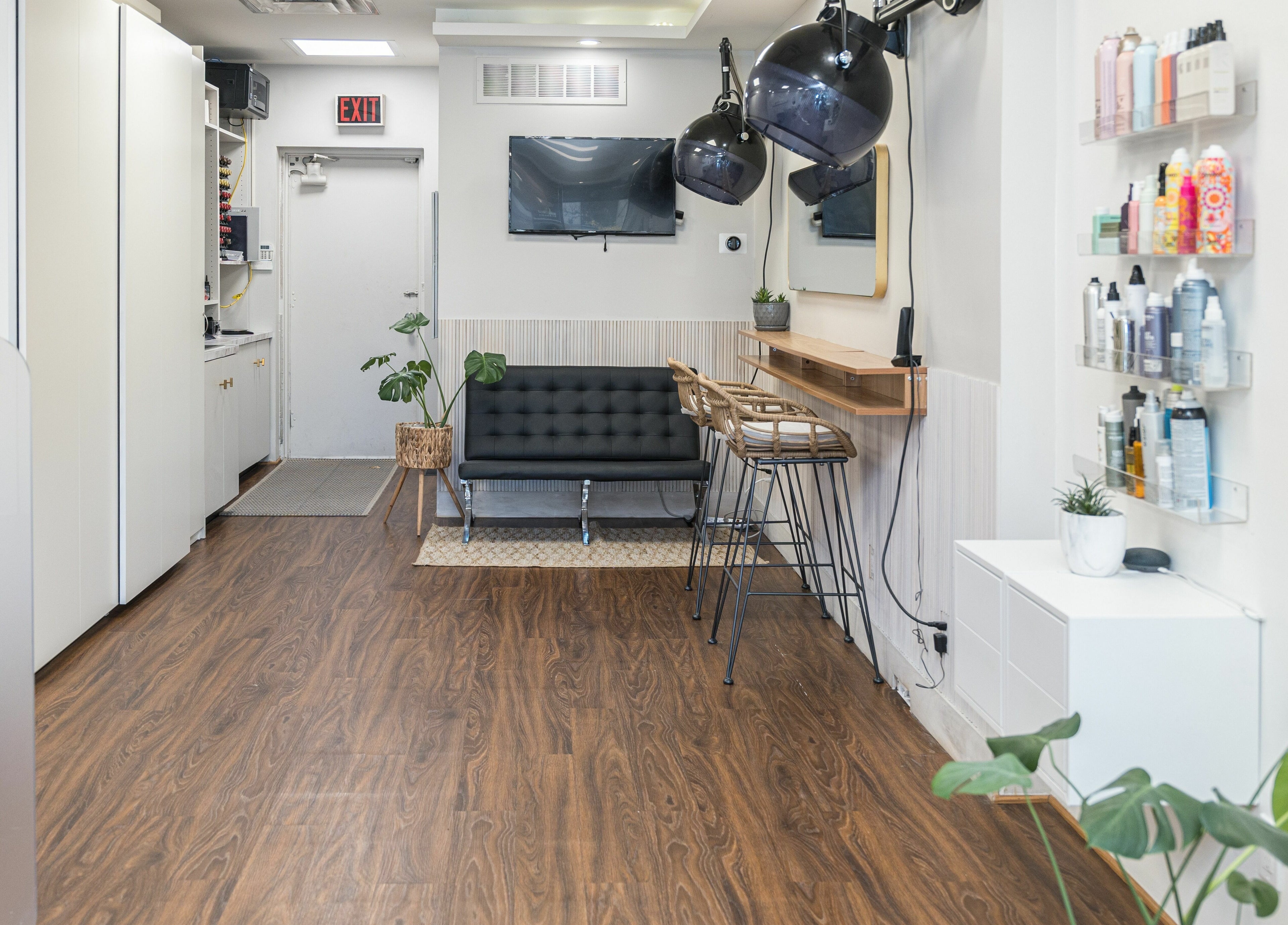 Modern interior of Twin Scissors salon in Toronto, Ontario, CA with sleek decor and beauty products.