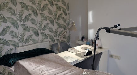 Tranquil treatment room at Marta's Beauty Lounge, Burton Upon Trent, England, GB with palm leaf decor.