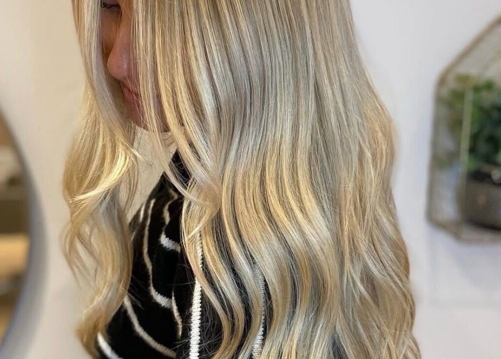 Golden blonde hair styled in waves at AmeliaJHair, Brighton And Hove, England, GB.