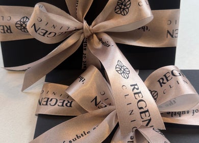 Stylish gift boxes with logo ribbons at Regen Clinic Norwich, Norwich, England, GB.