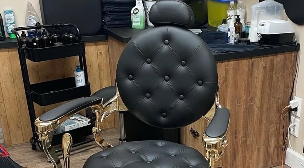 Elegant barber chair at 10/6 Barber Company, Belleville, Ontario, CA, showcasing a stylish interior.