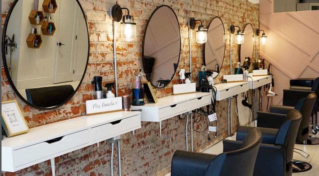Stylish salon interior at Elevate Beauty Lofts in Toronto, Ontario, CA with chic mirrors and modern chairs.