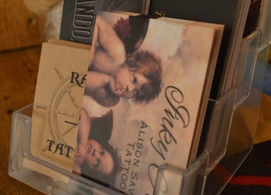 Close-up of artistic cards in display at R.I Studio, Cambridge, England, GB, showcasing creative designs.