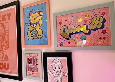 Creative wall art at Queen B Nail Artistry, London, England, GB showcasing unique designs and vibrant colors.