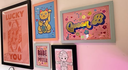 Creative wall art at Queen B Nail Artistry, London, England, GB showcasing unique designs and vibrant colors.