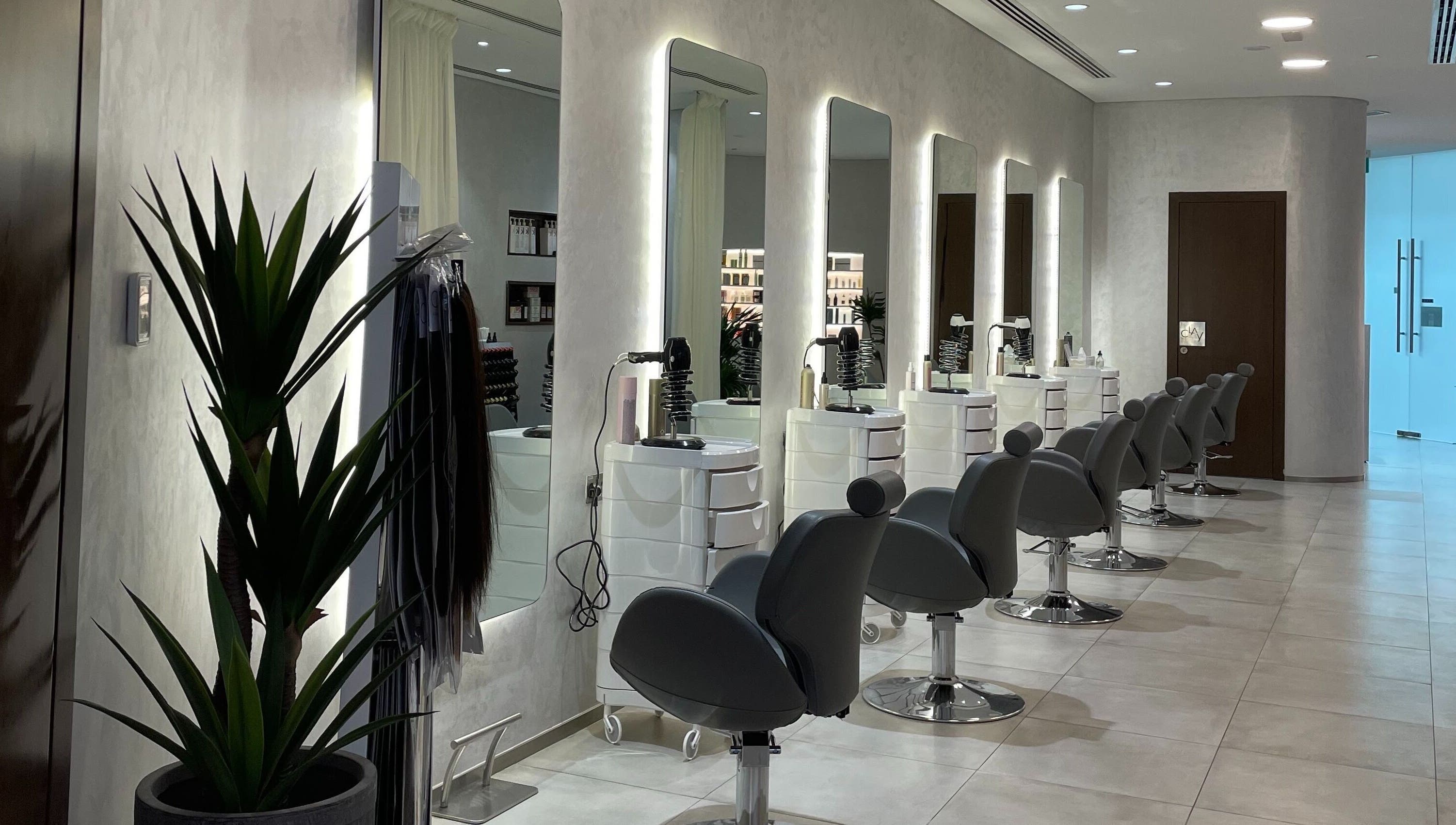 Modern salon chairs at Clay Beauty Lounge - Khaldiya in Abu Dhabi, AE, showcasing sleek and inviting design.
