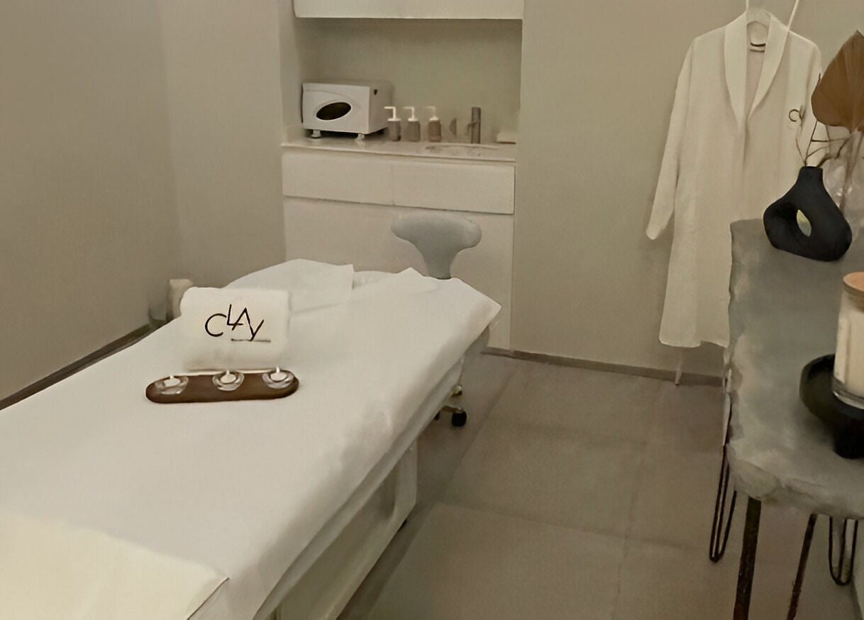 Relaxing spa room at Clay Beauty Lounge - Khaldiya in Abu Dhabi, AE, featuring a treatment bed and plush decor.