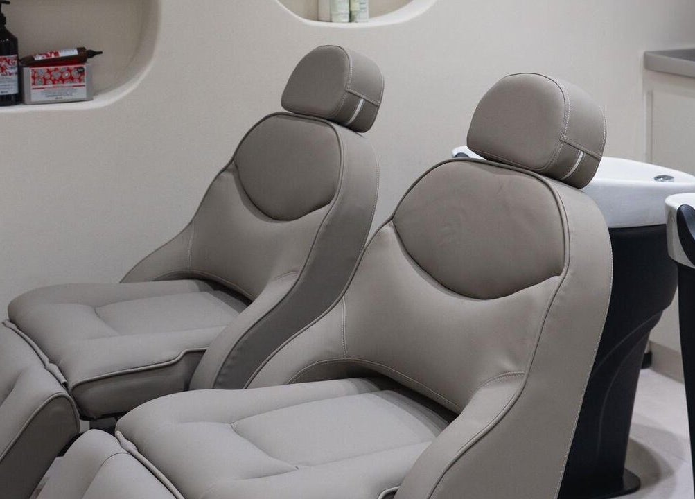 Comfortable salon chairs at Clay Beauty Lounge - Mushrif in Abu Dhabi, Abu Dhabi, AE offer a relaxing experience.