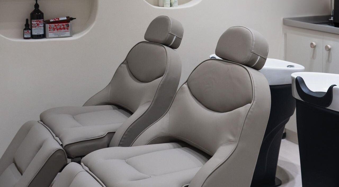 Comfortable salon chairs at Clay Beauty Lounge - Mushrif in Abu Dhabi, Abu Dhabi, AE offer a relaxing experience.