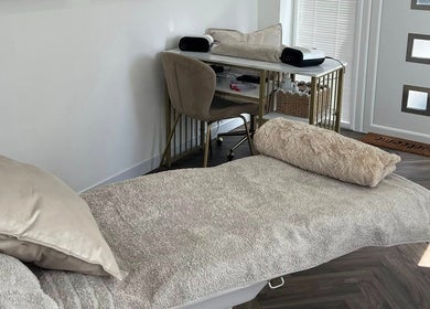 Luxurious treatment room at Chelle's Beauty, Lytham St Anne’s, England, GB, featuring a plush treatment bed.