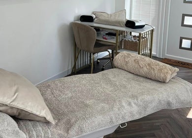Tranquil spa room at Chelle's Beauty, Lytham St Anne’s, England, GB, featuring plush bedding and elegant decor.