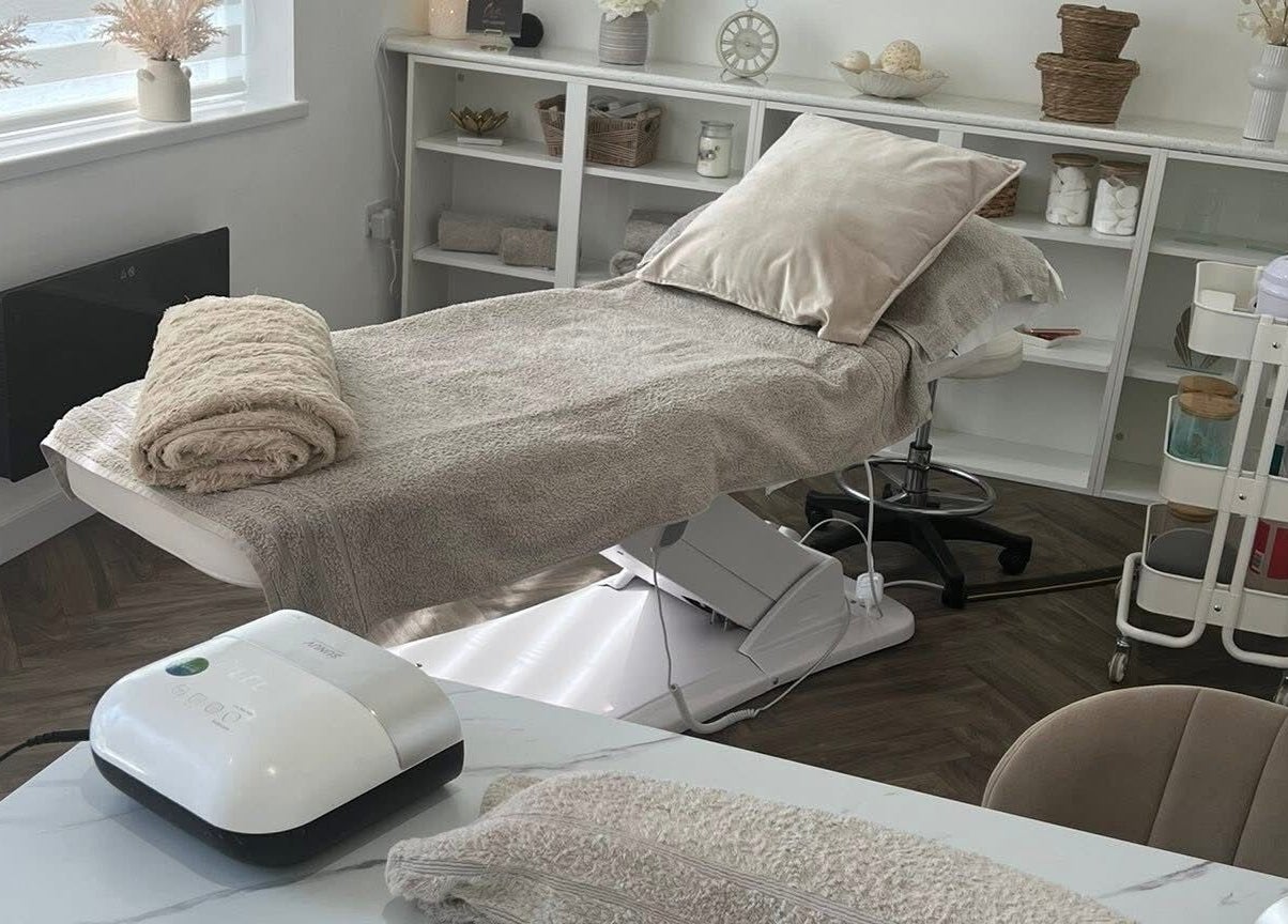 Relaxing beauty treatment room at Chelle's Beauty, Lytham St Anne’s, England, GB with massage bed and decor.