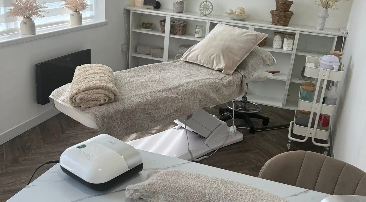 Relaxing beauty treatment room at Chelle's Beauty, Lytham St Anne’s, England, GB with massage bed and decor.