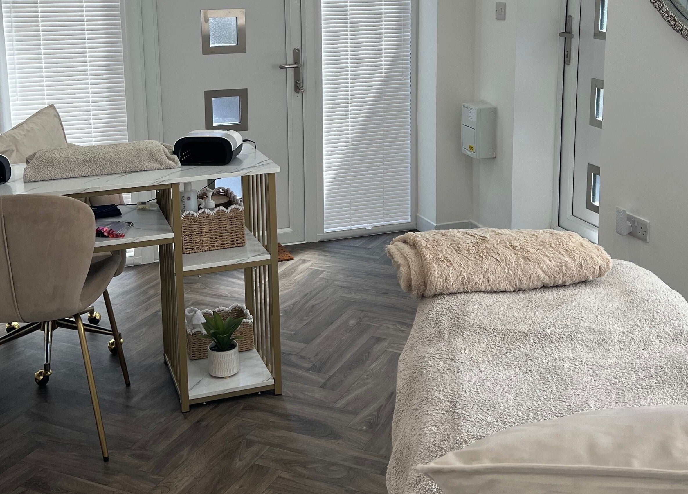 Modern treatment room at Chelle's Beauty, Lytham St Anne’s, England, GB with cozy decor and plush furnishing.