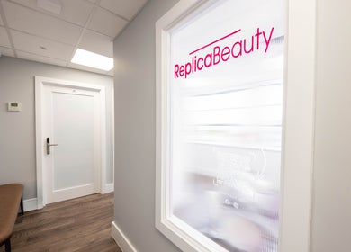 Entrance hallway of Replica Beauty in London, England, GB with stylish decor and soft lighting.