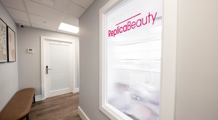 Entrance hallway of Replica Beauty in London, England, GB with stylish decor and soft lighting.