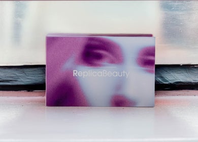 Elegant Replica Beauty logo on a stylish purple card at London, England, GB location.