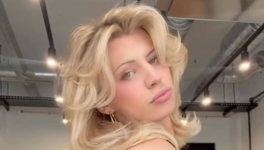 Blonde woman with stylish hairstyle at MOUR Hair, London, England, GB.