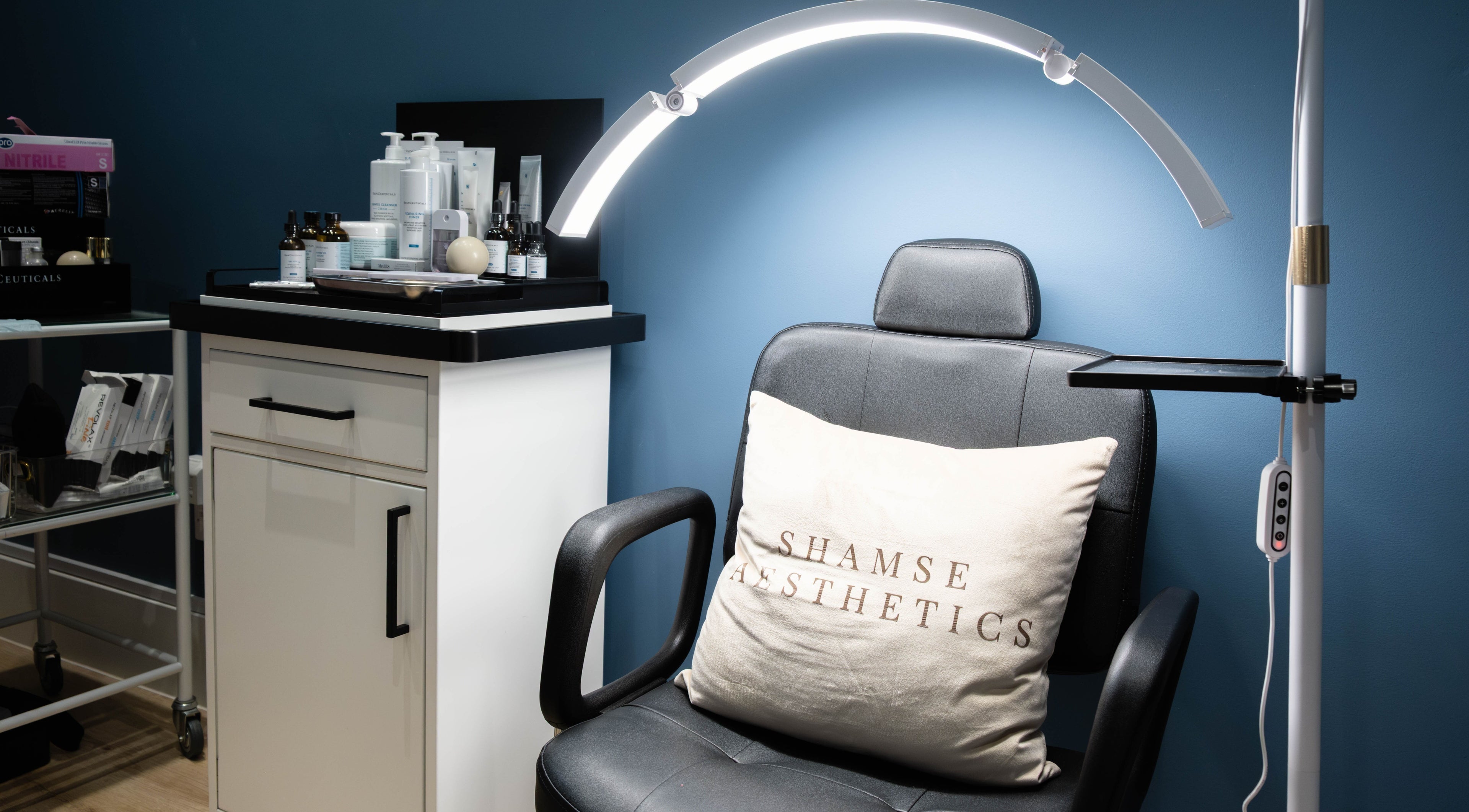 Comfortable chair and equipment in ShamseAesthetics Harley Street, London, England, GB's modern treatment room.