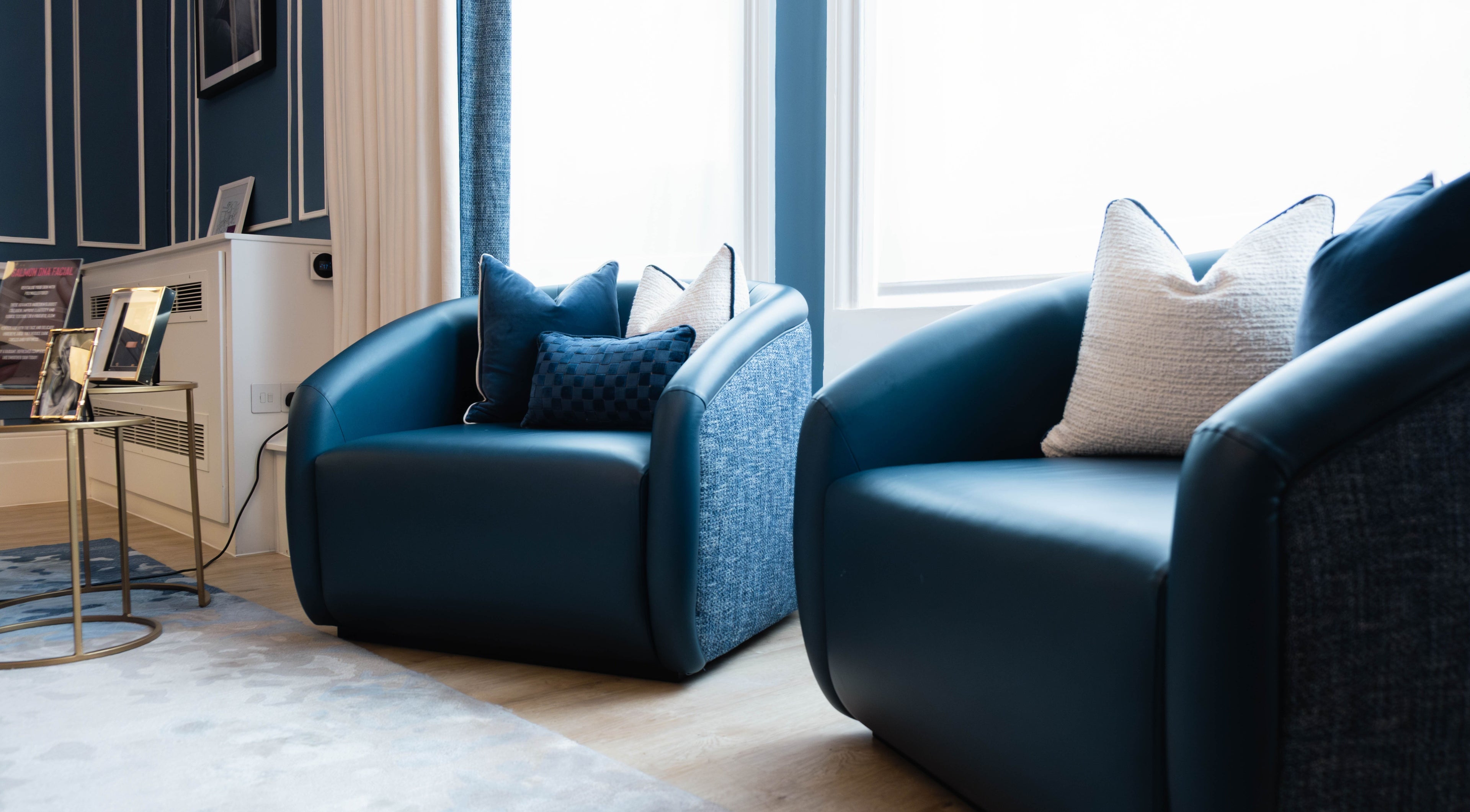 Elegant lounge chairs at ShamseAesthetics Harley Street, London, England, GB create a welcoming atmosphere.