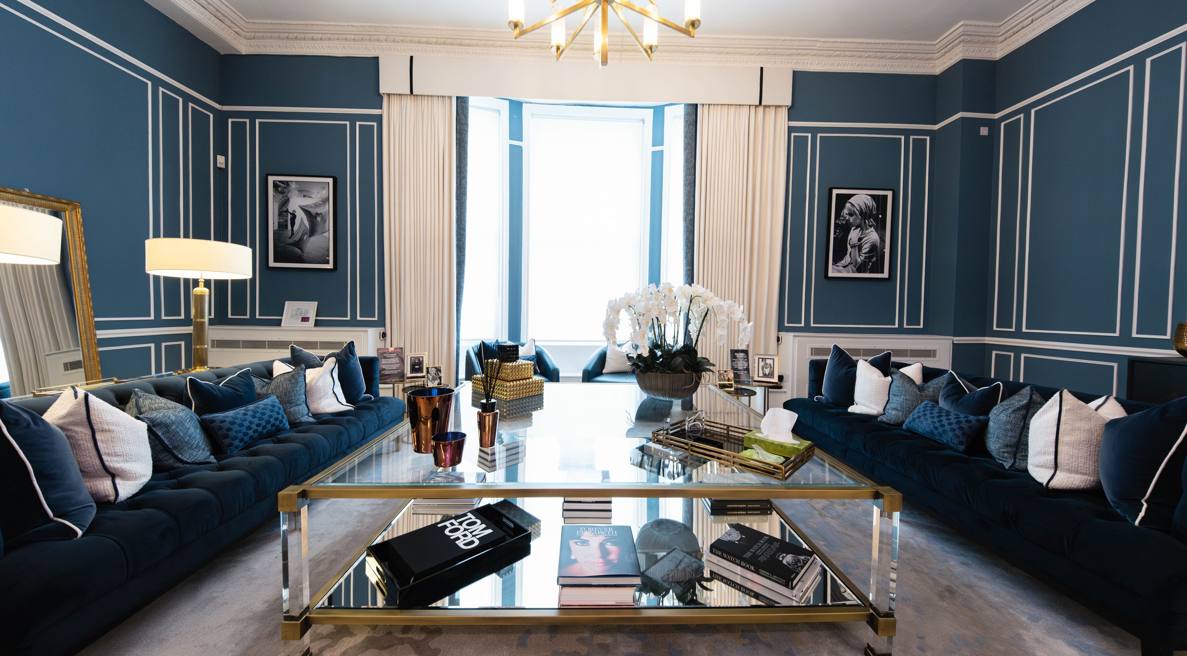 Elegant lounge at ShamseAesthetics Harley Street, London, England, GB. Features blue decor and stylish furnishings.