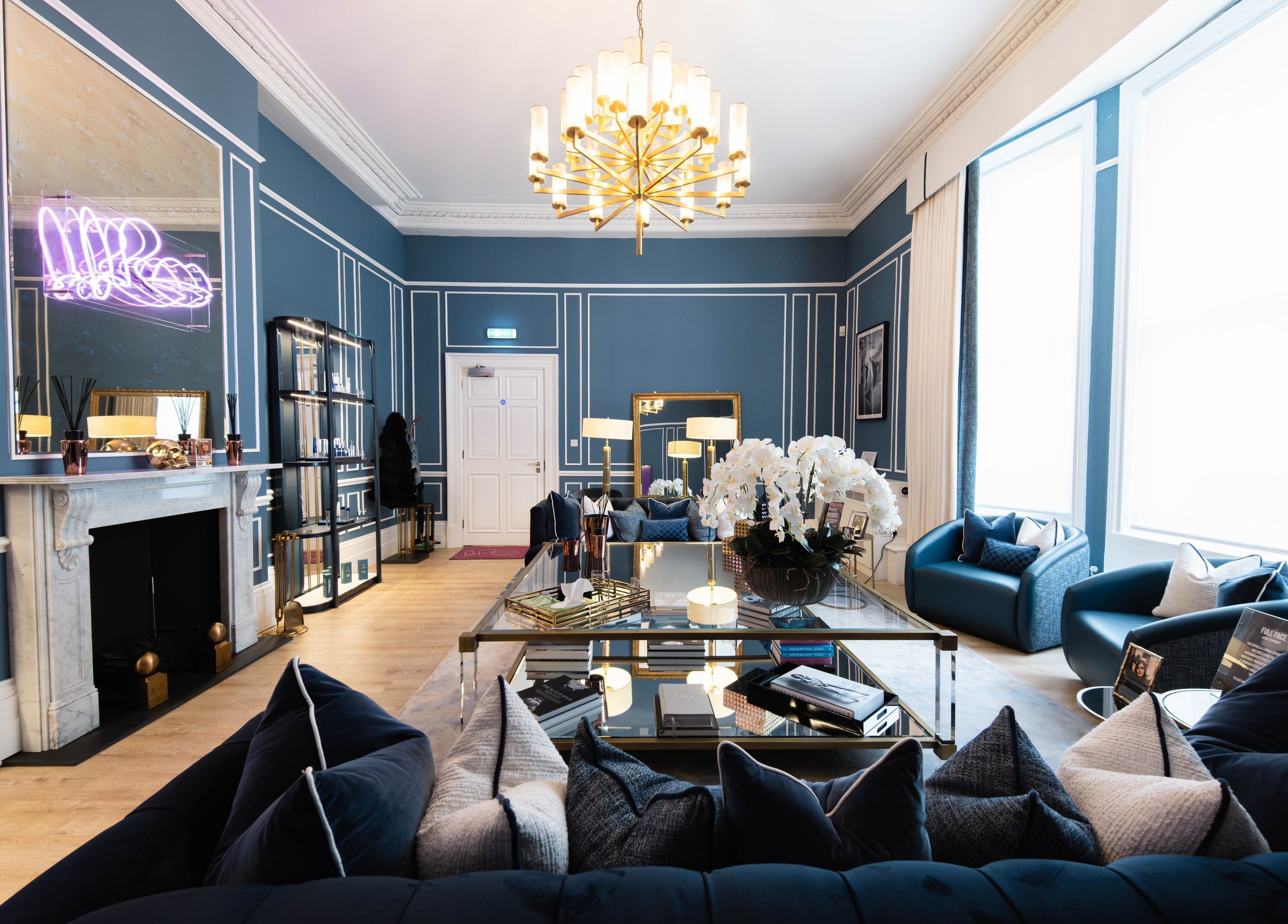 Luxurious interior at ShamseAesthetics Harley Street, London, England, GB, showcasing blue decor and chic furnishings.