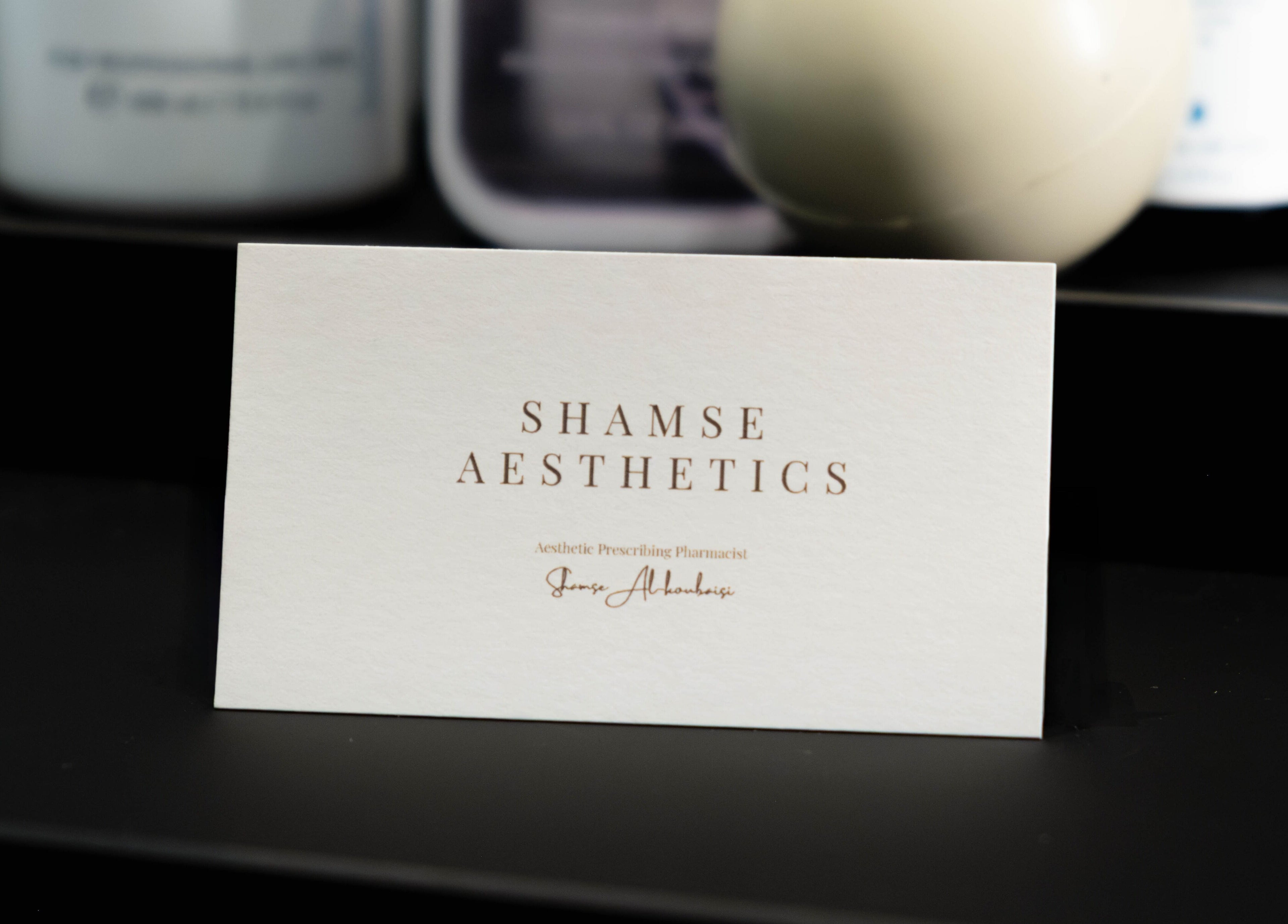 ShamseAesthetics Harley Street branding card, London, England, GB, showcasing sleek design and elegance.