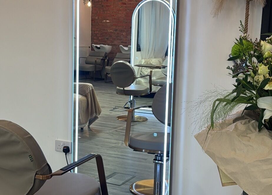 Modern styling chair and floral decor at Utopia Hair Co, Clifton, England, GB.