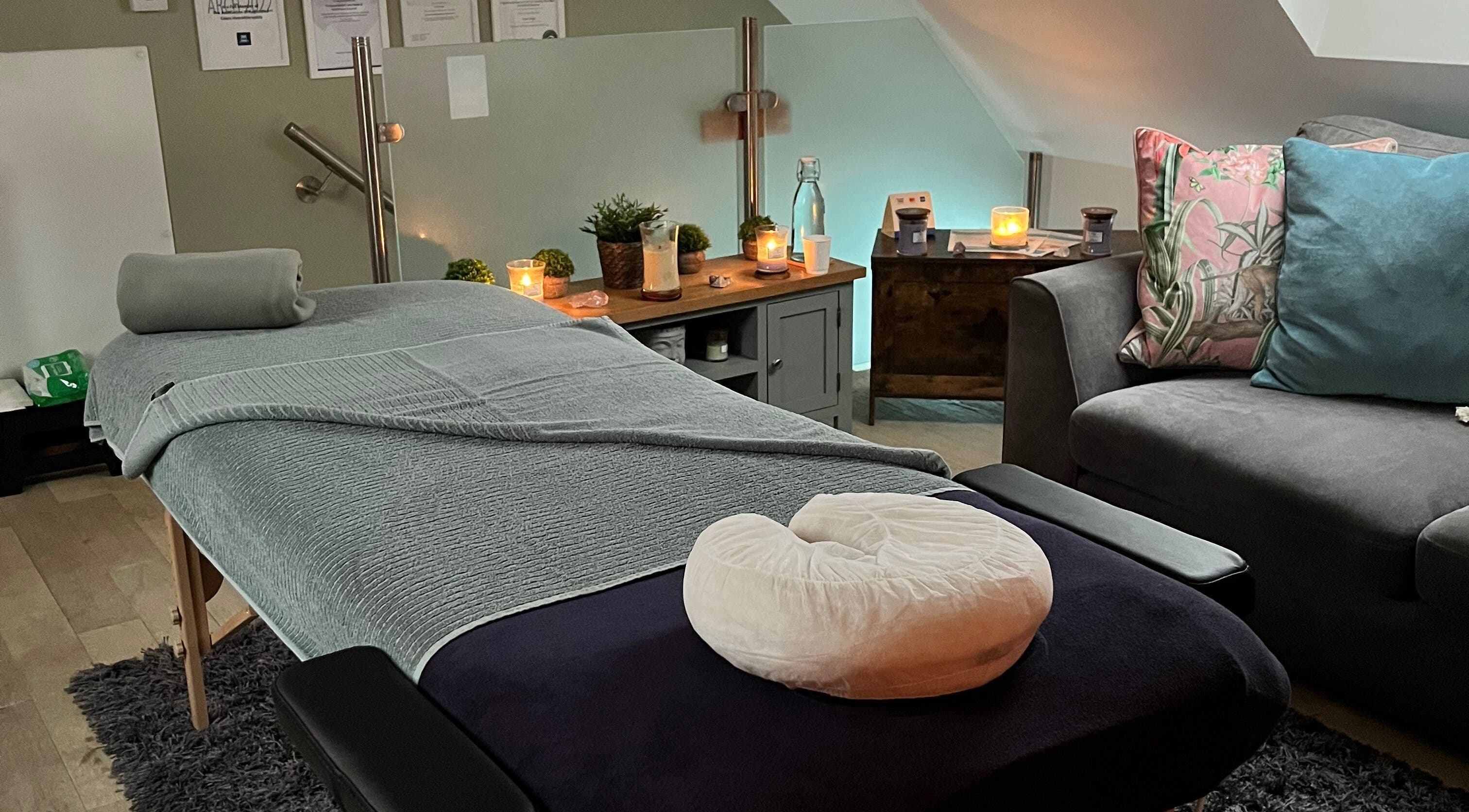 Relaxing massage room at Birchfield Road Clinic, Northampton, England, GB, with candles and cozy ambiance.