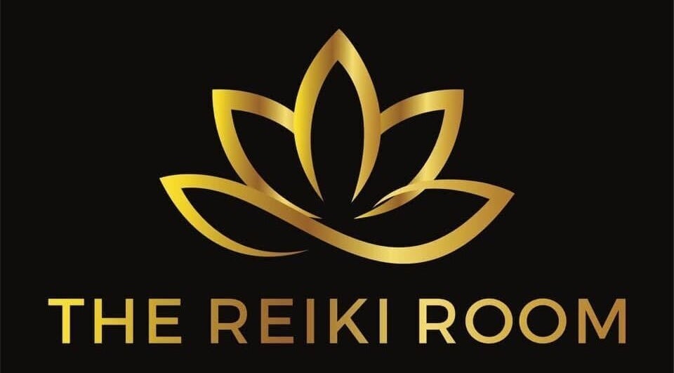 Elegant gold lotus logo of The Reiki Room in Townsville, Queensland, AU on a sleek black background.