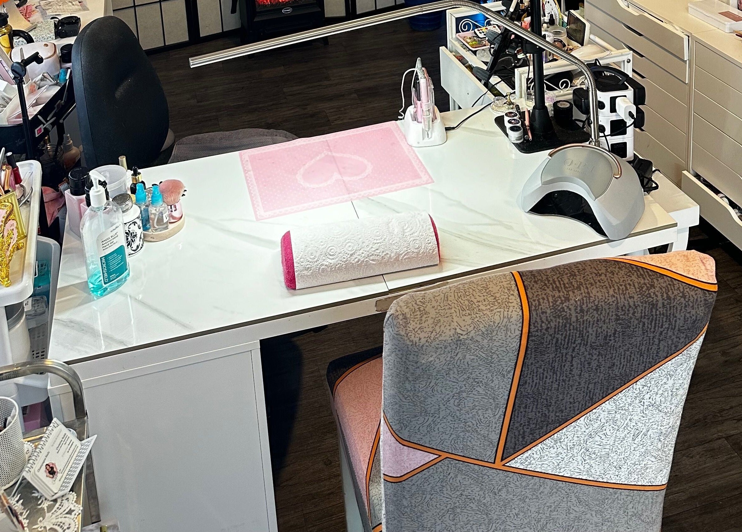 Elegant nail workstation at Champagne Nails NZ, Rotorua, Bay Of Plenty, NZ, featuring tools and decor.