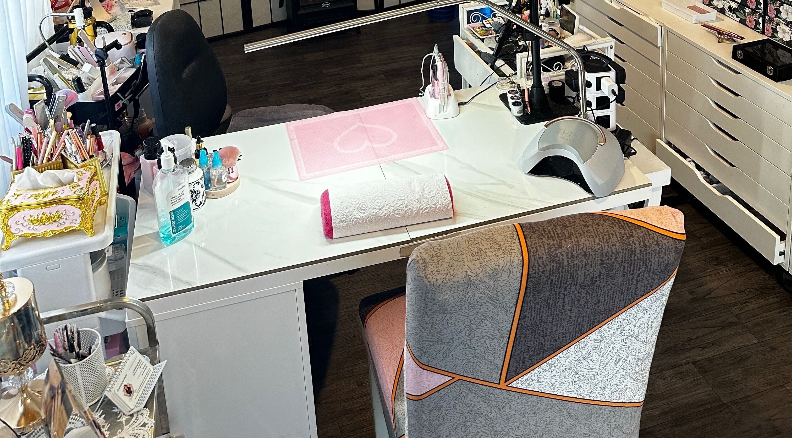 Elegant nail workstation at Champagne Nails NZ, Rotorua, Bay Of Plenty, NZ, featuring tools and decor.