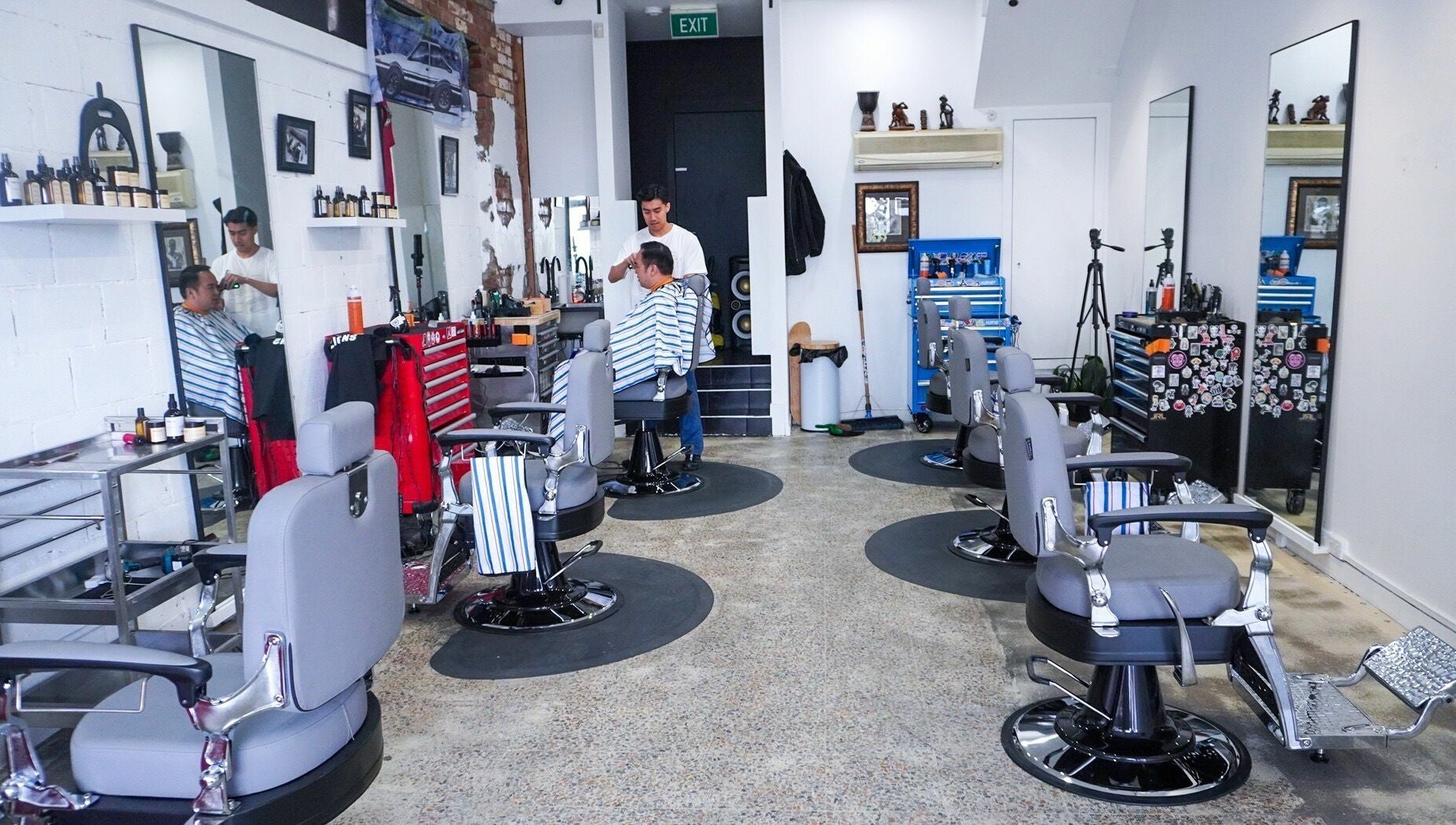 Interior of Be Good Studio barber area in Melbourne, Victoria, AU, showcasing stylish chairs and mirrors.